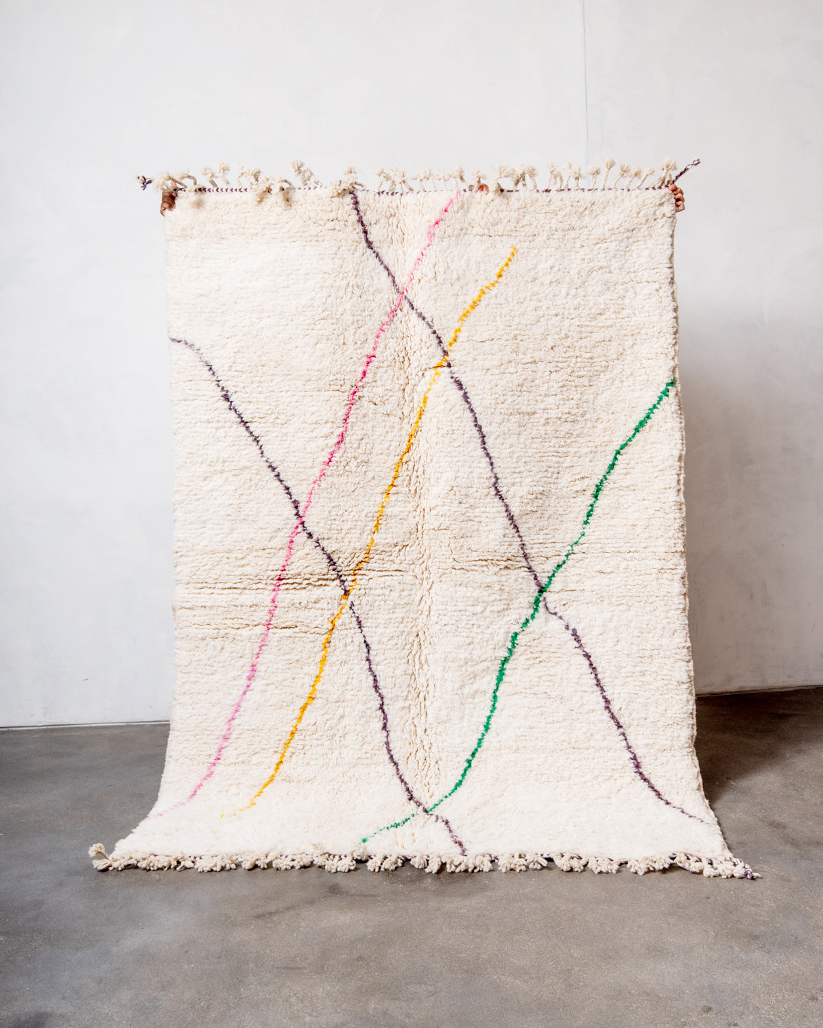 Modern, designer, handcrafted Berber rug from Morocco. Beniourain carpet with beautiful colours and patterns and fluffy wool texture.